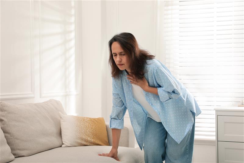 mature woman suffering breathing problem