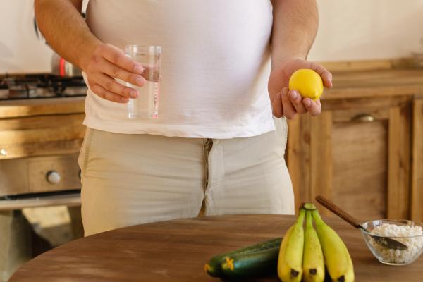 Overweight man considering healthy food options