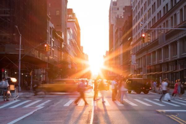New york city street with sun rise coming through the buildings