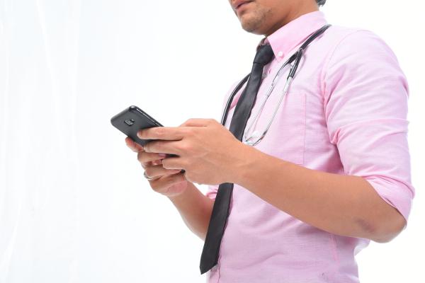 Man with diabetes checking his blood glucose on his phone