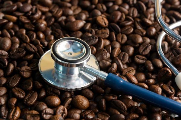 stock-photo-coffee-beans-and-stethoscope-in-concept-health-of-coffee-drinkers-quality-of-coffee