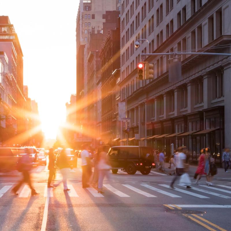 New york city street with sun rise coming through the buildings