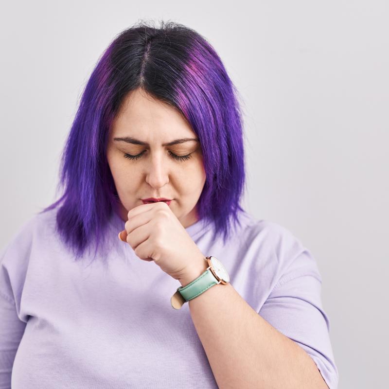 Woman with purple hair and severe asthma