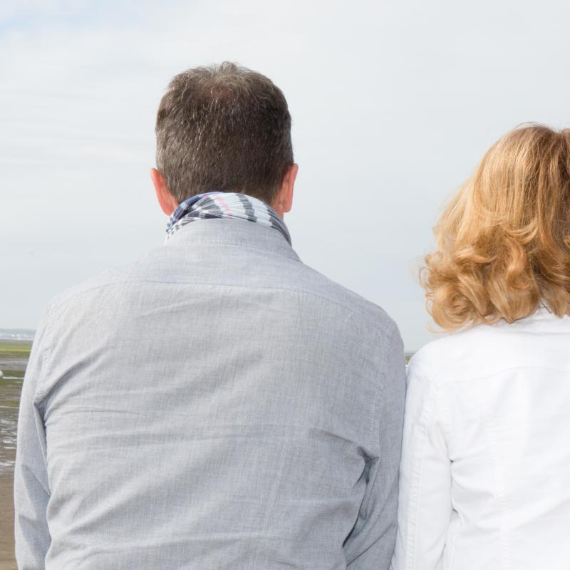 rear view of man and woman sitting together