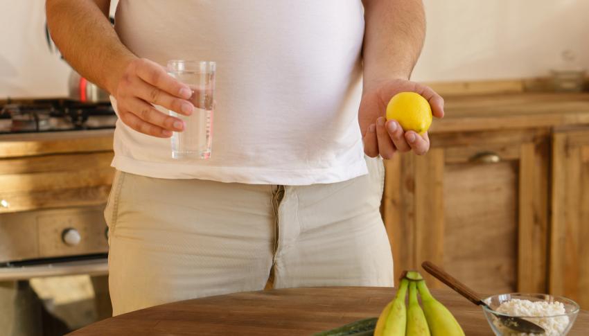 Overweight man considering healthy food options