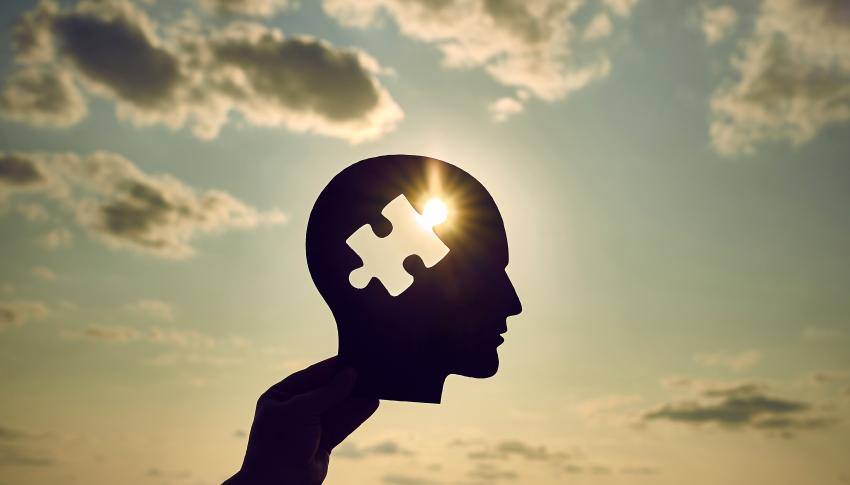 Concept of a human head with a puzzle in the middle