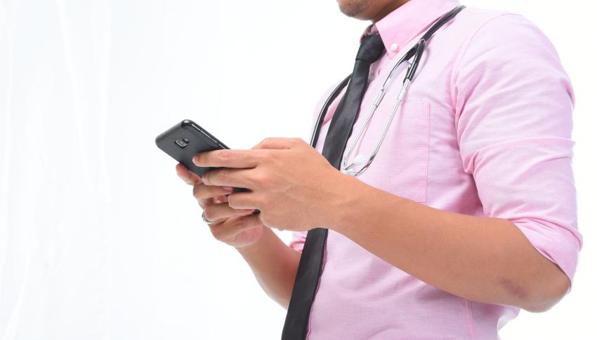 Man with diabetes checking his blood glucose on his phone