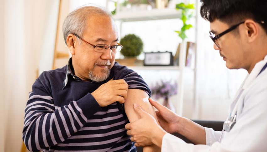 Older man getting COVID-19 vaccination