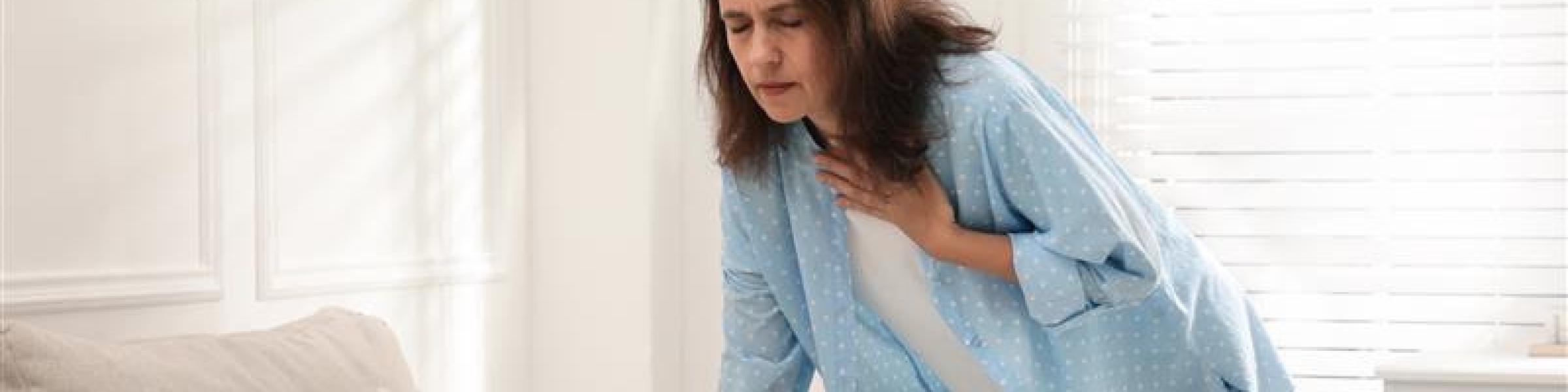mature woman suffering breathing problem