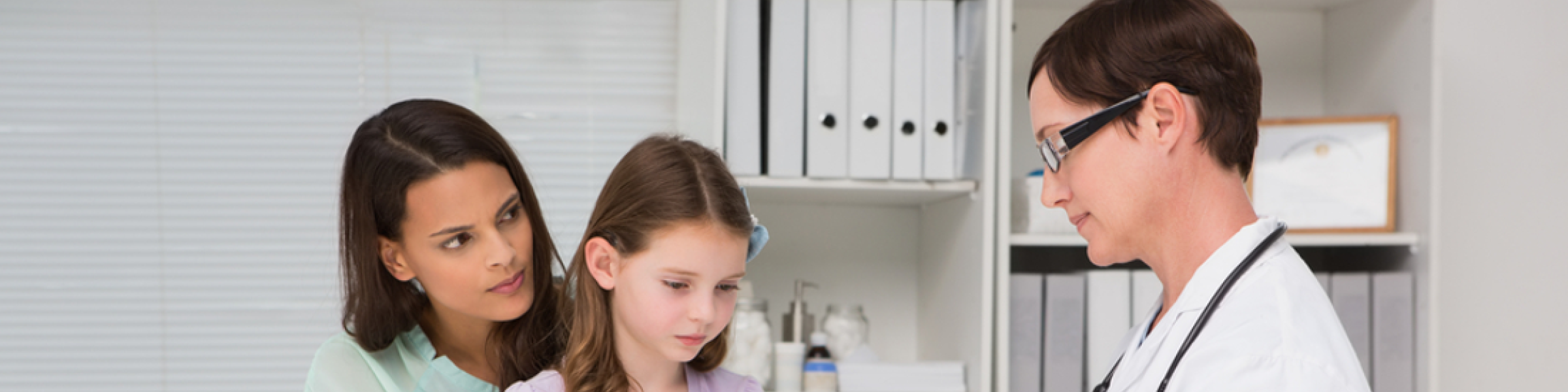 Woman and child talking to a doctor