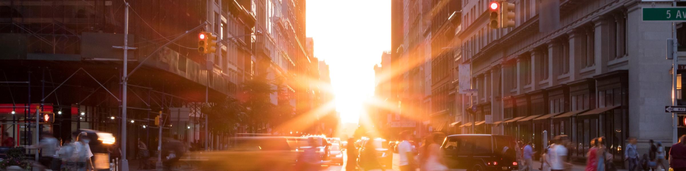 New york city street with sun rise coming through the buildings