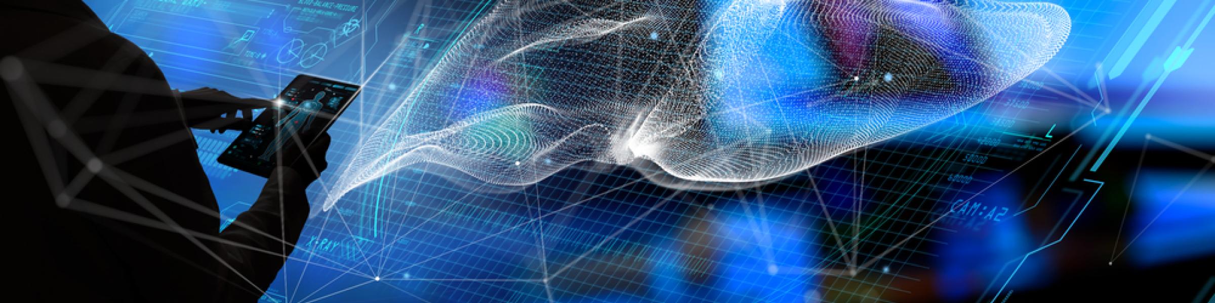 Silhouette of a person operating a tablet compouter in front a digital projection of liver imagery