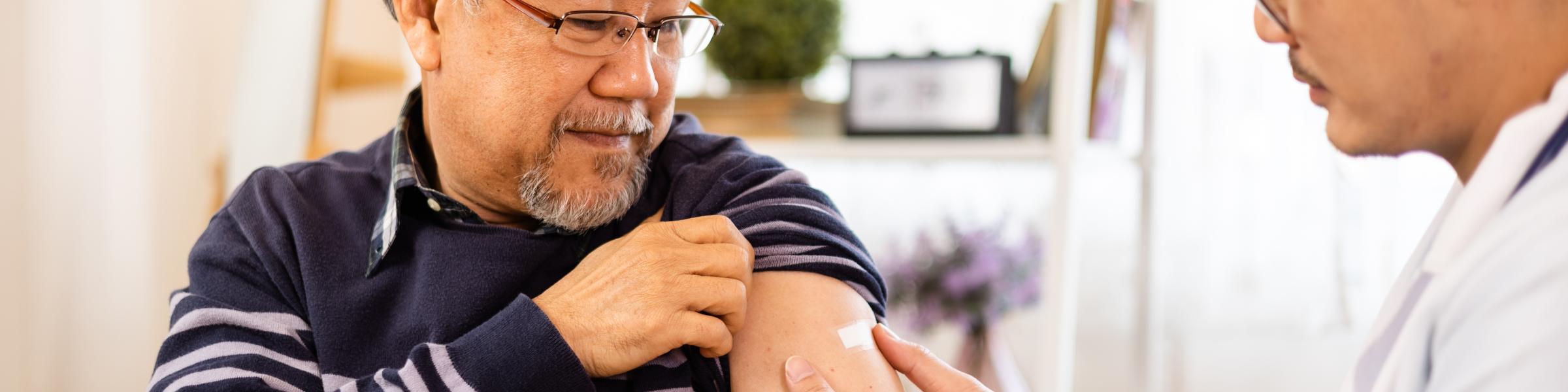 Older man getting his COVID-19 vaccination
