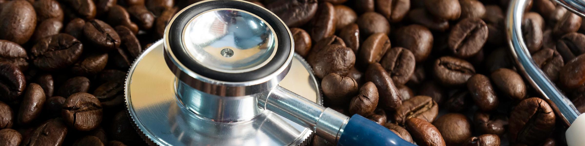 stock-photo-coffee-beans-and-stethoscope-in-concept-health-of-coffee-drinkers-quality-of-coffee